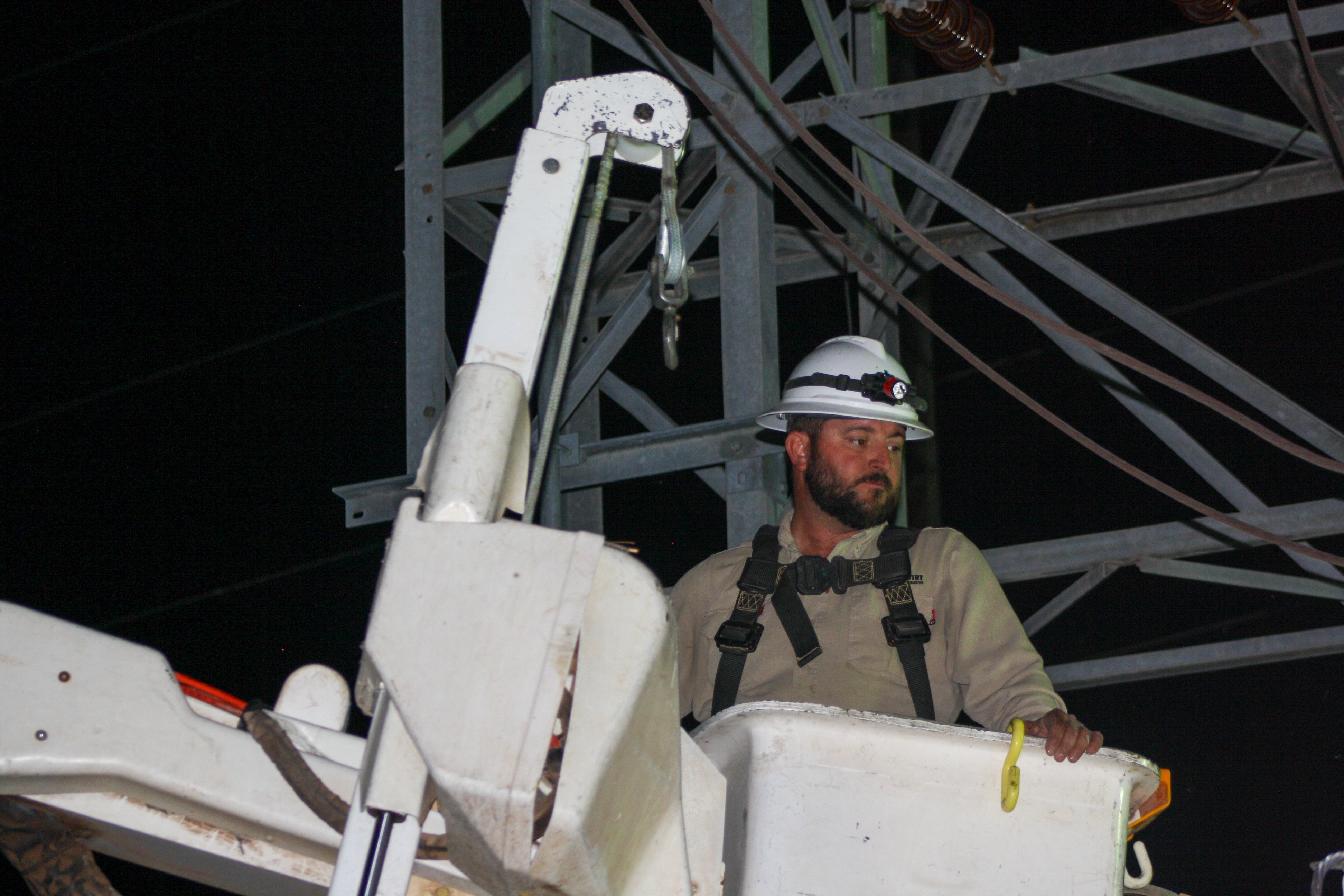 Lineworker in Bucket at Night